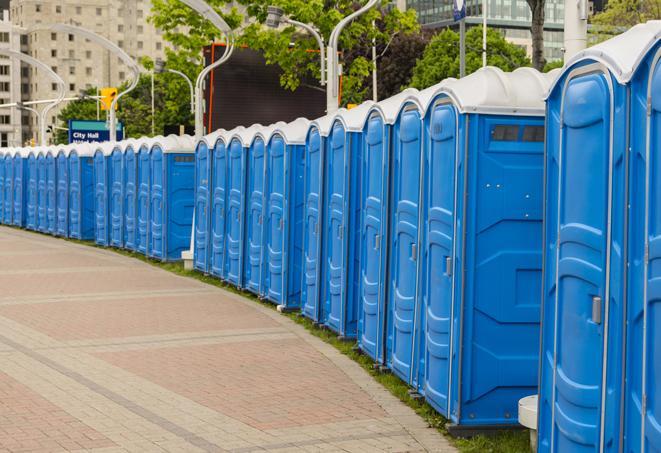 a row of portable restrooms at a fairground, offering visitors a clean and hassle-free experience in dalworthington